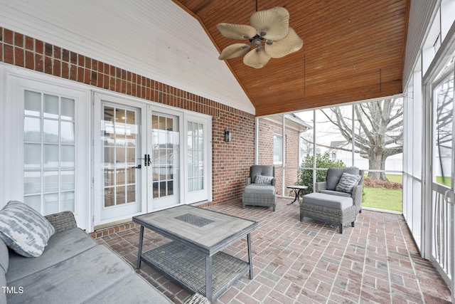 sunroom featuring french doors, wooden ceiling, ceiling fan, and lofted ceiling