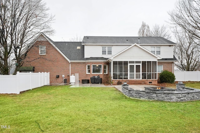 back of house featuring a yard, central air condition unit, a patio area, and a sunroom