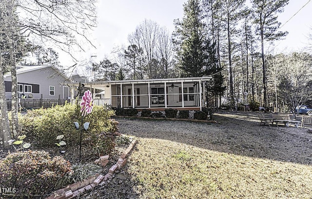 back of property featuring a sunroom