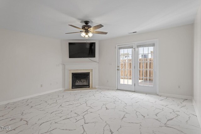 2248 Ventana Ln, Raleigh, NC 27604 - unfurnished living room with marble look tile flooring, a ceiling fan, and a fireplace with flush hearth