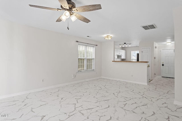 2248 Ventana Ln, Raleigh, NC 27604 - unfurnished living room with light marble finish flooring and a ceiling fan