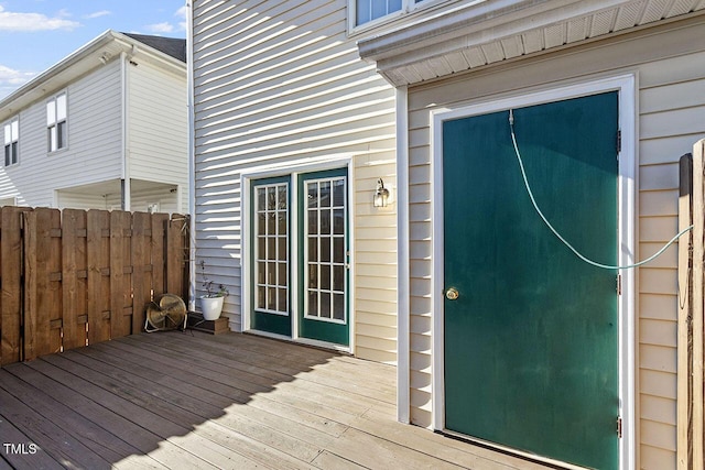 entrance to property featuring a wooden deck