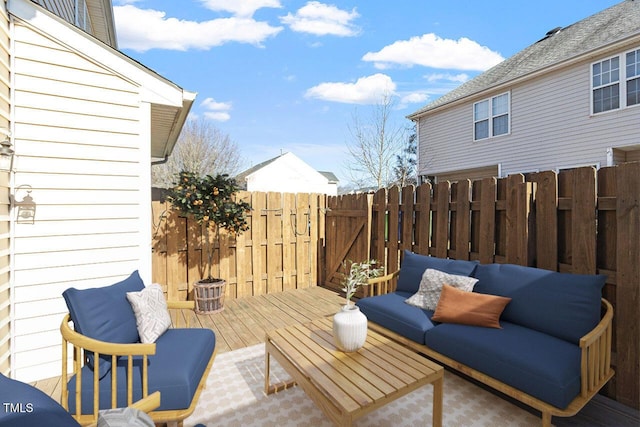 view of patio with a wooden deck and an outdoor hangout area