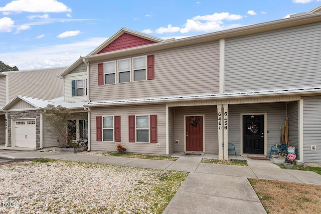 multi unit property featuring a garage