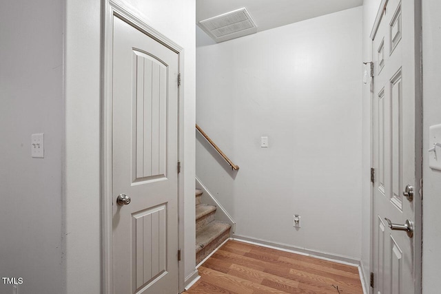 staircase featuring wood-type flooring