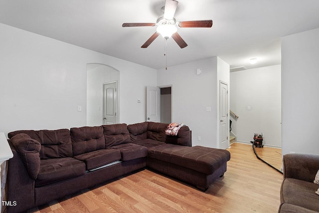 living room with ceiling fan and light wood-type flooring