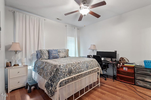 bedroom featuring hardwood / wood-style floors and ceiling fan