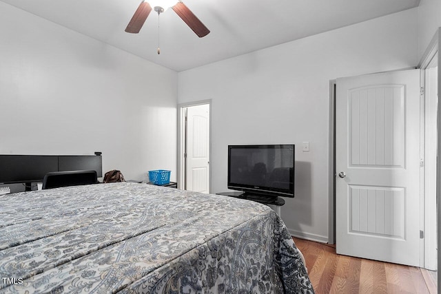 bedroom featuring ceiling fan and light hardwood / wood-style flooring