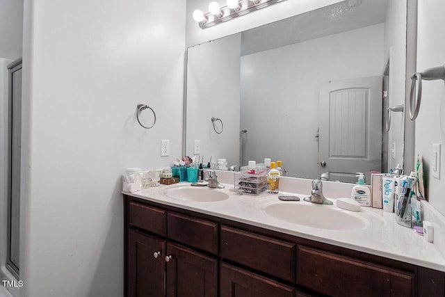 bathroom with vanity and walk in shower