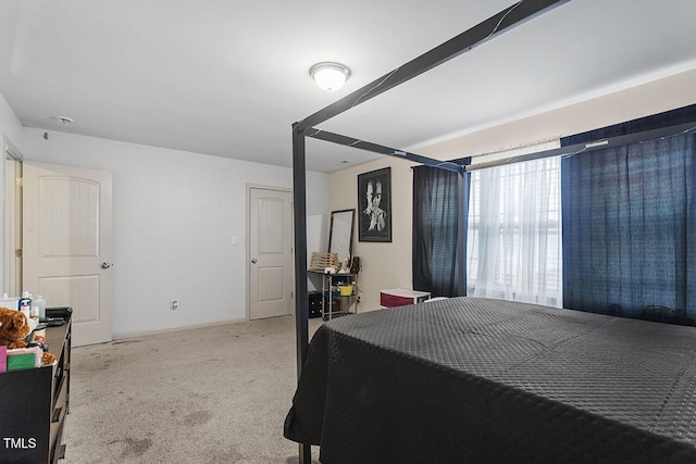 bedroom with light colored carpet