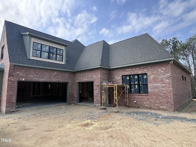 274 Westhampton Dr, Pittsboro, NC 27312 - view of front of property featuring brick siding, dirt driveway, and roof with shingles
