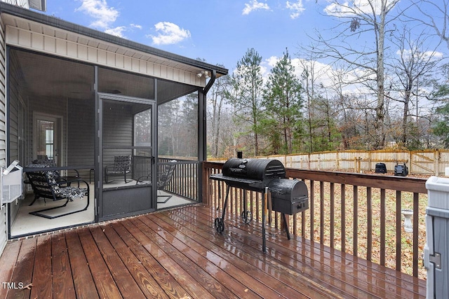 wooden terrace featuring area for grilling and a sunroom