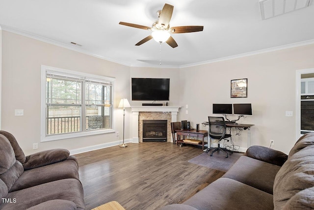 living room with crown molding, ceiling fan, and hardwood / wood-style flooring