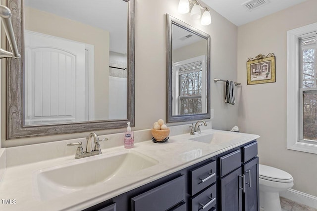 bathroom with vanity and toilet