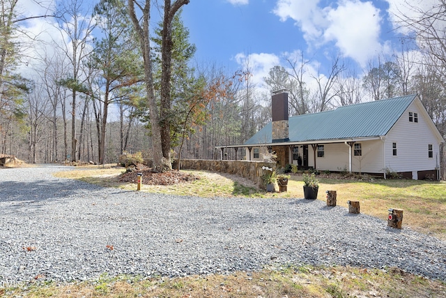 540 Patterson Dr, Chapel Hill, NC 27516 - view of front facade with a chimney and metal roof