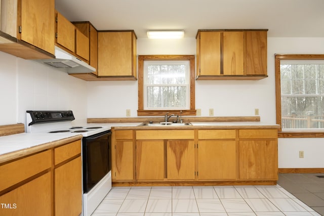 540 Patterson Dr, Chapel Hill, NC 27516 - kitchen featuring tile countertops, electric range, a wealth of natural light, and a sink