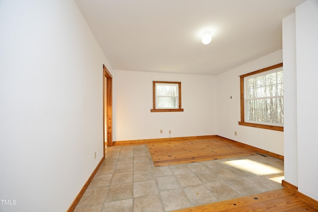 540 Patterson Dr, Chapel Hill, NC 27516 - spare room featuring light tile patterned flooring and baseboards