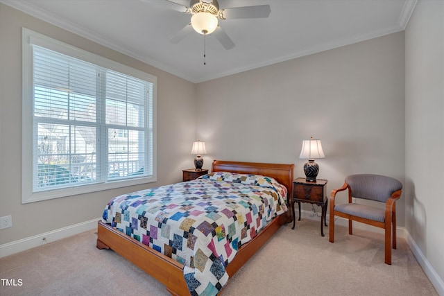 carpeted bedroom with ceiling fan and crown molding