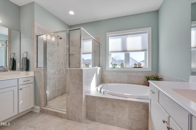 bathroom featuring separate shower and tub, tile patterned flooring, and vanity