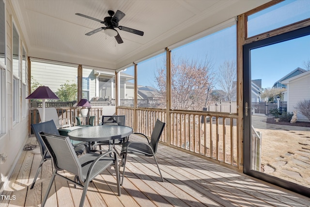 sunroom / solarium with ceiling fan