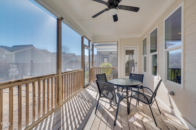 sunroom / solarium with ceiling fan