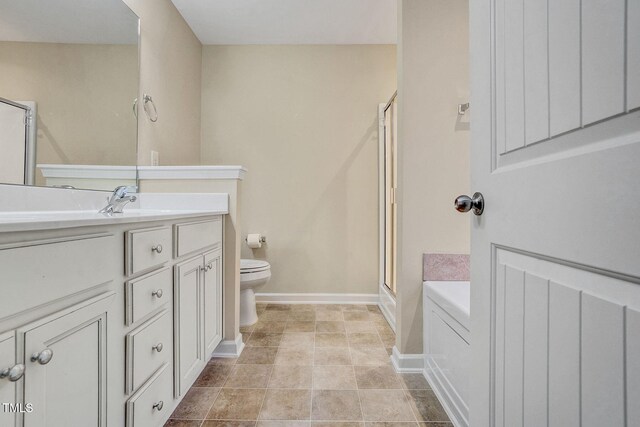 full bathroom with toilet, vanity, and shower with separate bathtub