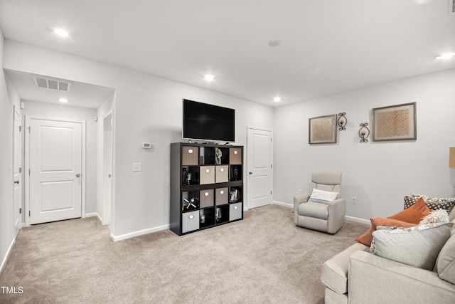 living area with recessed lighting, visible vents, carpet floors, and baseboards