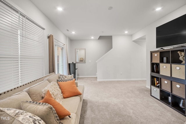 living room featuring recessed lighting, baseboards, and carpet floors