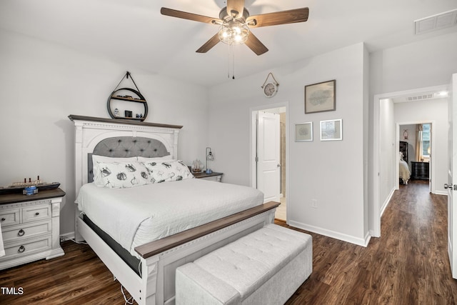 bedroom featuring dark wood finished floors, visible vents, a ceiling fan, and baseboards