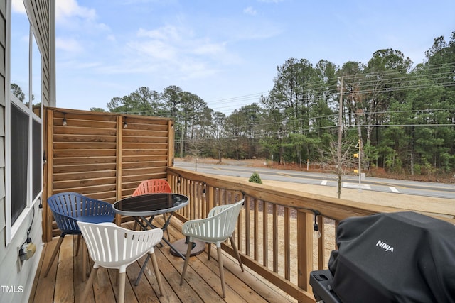 wooden terrace with grilling area