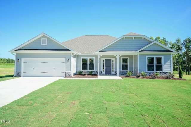 craftsman inspired home featuring stone siding, driveway, an attached garage, and a front yard