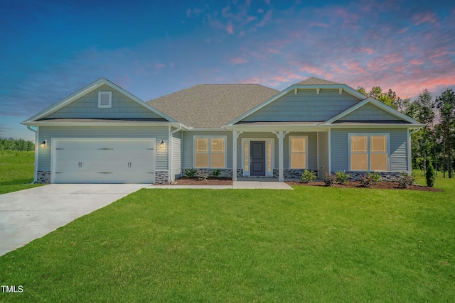 craftsman-style house featuring a front lawn, concrete driveway, a porch, stone siding, and a garage