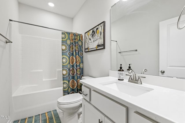 full bathroom featuring vanity, shower / bath combination with curtain, and toilet