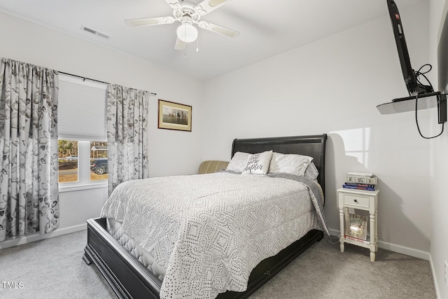 bedroom with ceiling fan and carpet floors