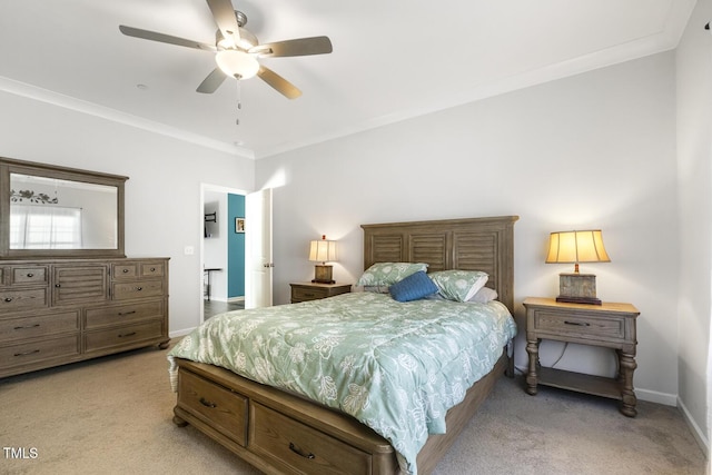 carpeted bedroom with ceiling fan and crown molding