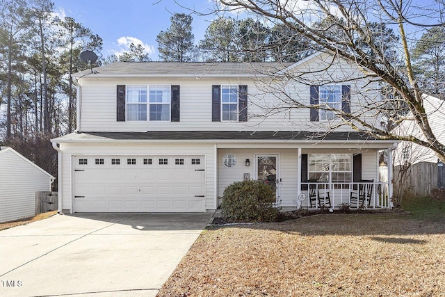 front of property featuring a porch, a garage, and a front lawn