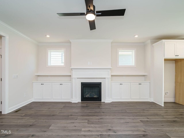 1809 Bright Lantern Way, Wendell, NC 27591 - unfurnished living room featuring ornamental molding, ceiling fan, recessed lighting, wood finished floors, and a glass covered fireplace
