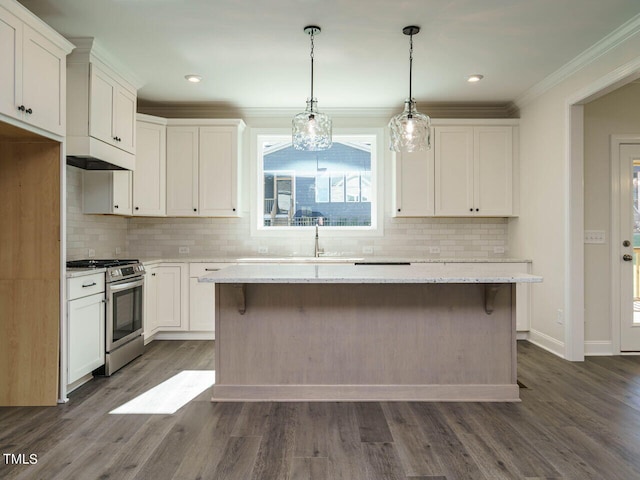 1809 Bright Lantern Way, Wendell, NC 27591 - kitchen with stainless steel gas range oven, a kitchen island, white cabinets, crown molding, and recessed lighting