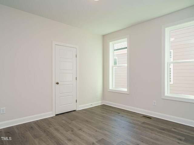 1809 Bright Lantern Way, Wendell, NC 27591 - unfurnished room featuring dark wood-style flooring and baseboards