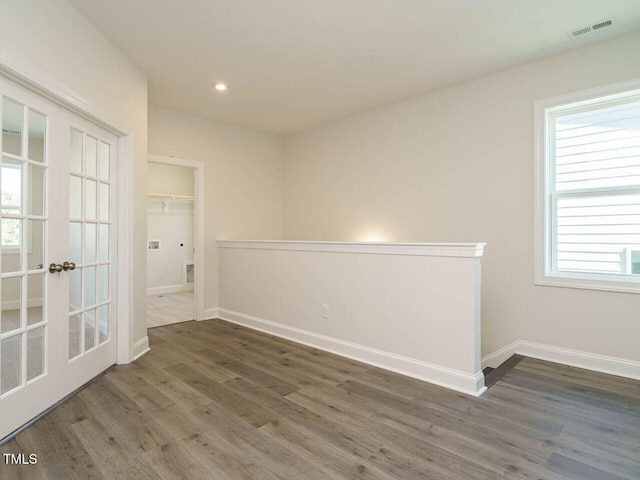 1809 Bright Lantern Way, Wendell, NC 27591 - spare room featuring wood finished floors, french doors, and recessed lighting