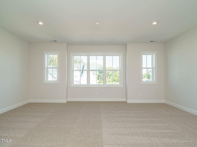 1809 Bright Lantern Way, Wendell, NC 27591 - empty room featuring light carpet and recessed lighting