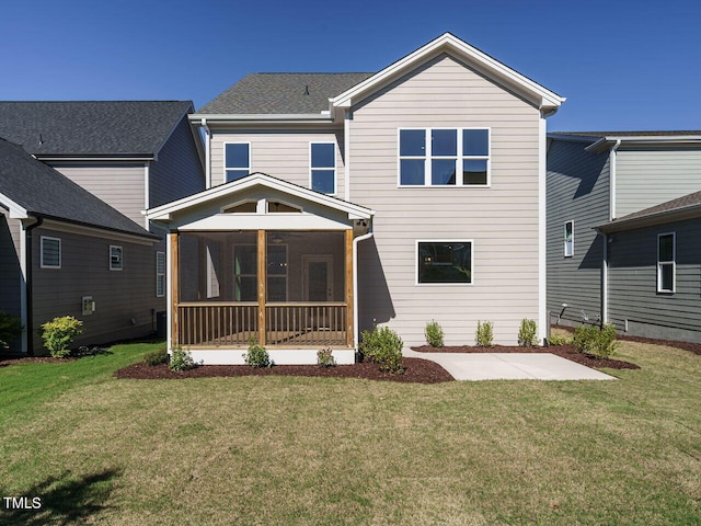 1809 Bright Lantern Way, Wendell, NC 27591 - rear view of house with a sunroom, a yard, and a patio