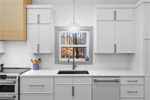 kitchen with stainless steel electric range, sink, white cabinetry, and pendant lighting