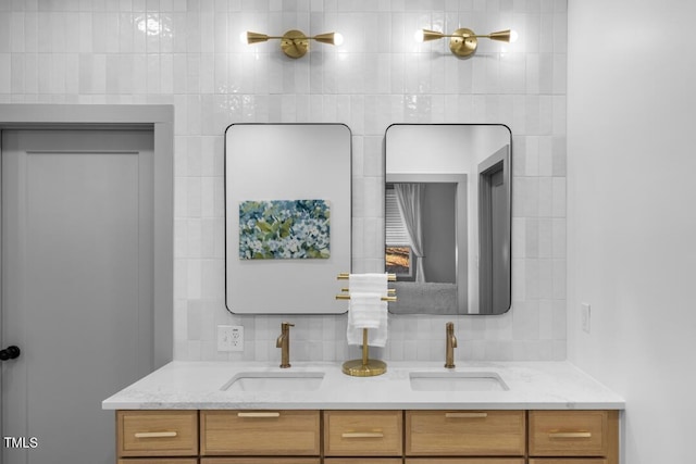 bathroom featuring tasteful backsplash and vanity