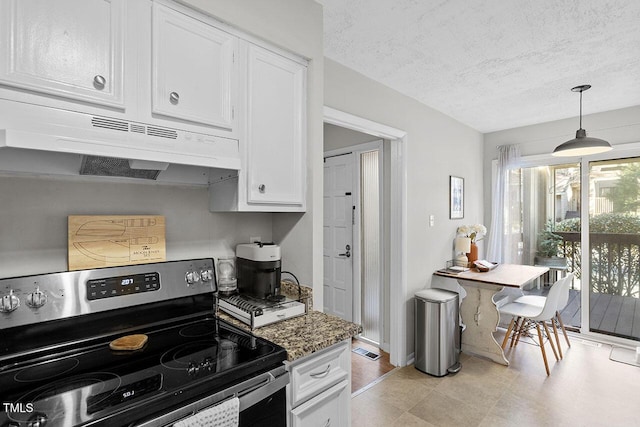 kitchen with dark stone counters, a textured ceiling, pendant lighting, white cabinetry, and stainless steel electric range