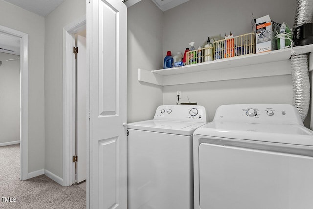 laundry area with light carpet and washing machine and clothes dryer