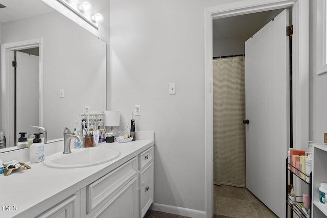 bathroom featuring tile patterned floors and vanity