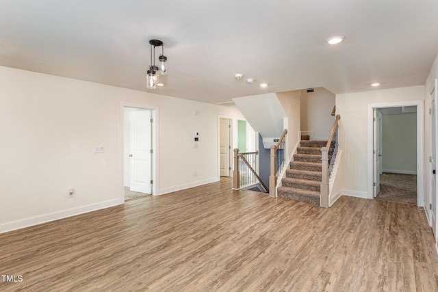 unfurnished living room with hardwood / wood-style flooring