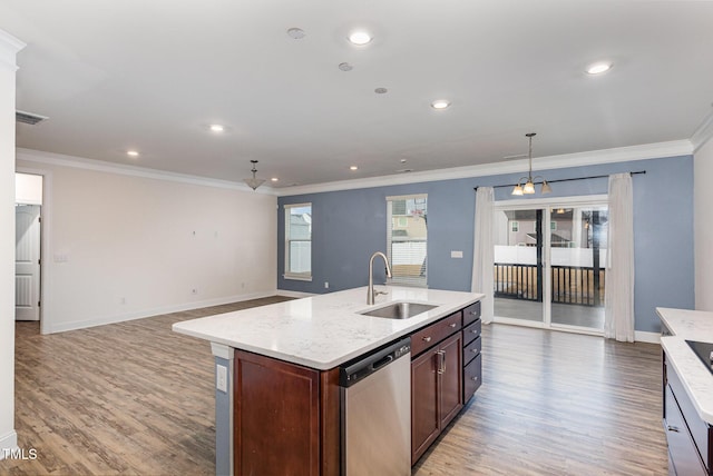 kitchen with dishwasher, a center island with sink, sink, ornamental molding, and decorative light fixtures