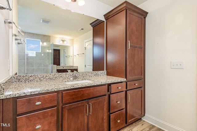 79 Stallion Way, Benson, NC 27504 - bathroom with a shower stall, vanity, and wood finished floors